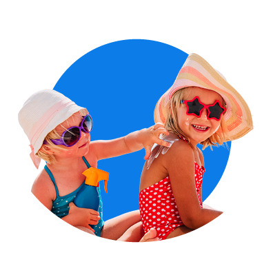 Two children in sun hats, swimming costumes and sunglasses, one applying sunscreen to the other, on a blue background.